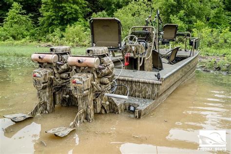 Other features include a wing-style beach seat, 18-gallon aerated livewell, starboard rod holder and dead grass paint job. . Prodigy duck boats